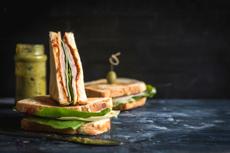 Toast sandwich with ham sliced on wooden background with blank space,selective focus の写真素材
