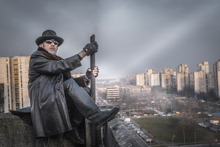 Fashionable man sitting on the roof top,selective focus の写真素材