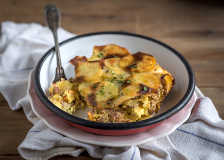 Prepred traditional Greek moussaka with potatoes served in the plate,selective focusの写真素材