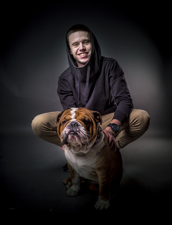 Portrait of young man with his pet,selective focus の写真素材