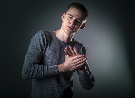 Studio portrait of young and positive manの写真素材