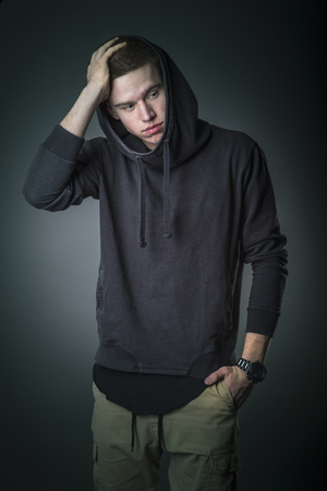 Portrait of young man in the studio の写真素材