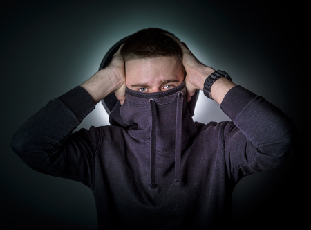 Man hiding his face with hoodieの写真素材