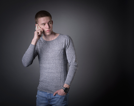 Portrait of man using his mobile phone の写真素材