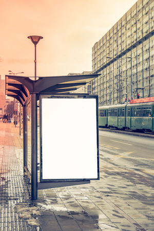 Bus station whit blank white billboard の写真素材