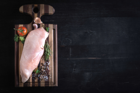 Raw chicken white meat on cutting board,blank space の写真素材