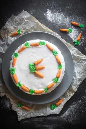 Glazed homemade carrot cake on the table,selective focus 