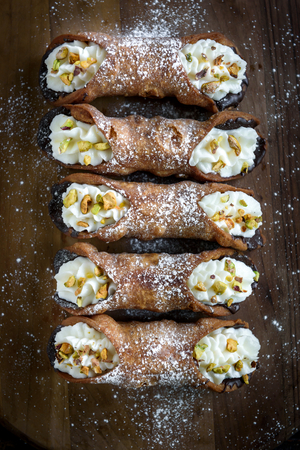 Traditional Italian dessert cannoli served on the table,selective focus の写真素材