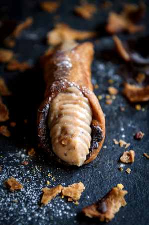 Close up to cannoli stuffed with ricotta and chocolate,selective focus の写真素材