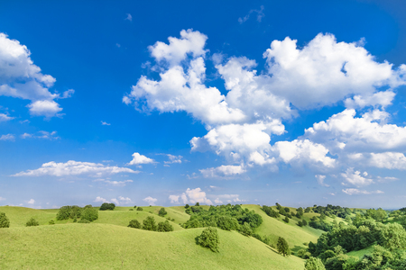 Green hills and beautiful cloudscapeの写真素材