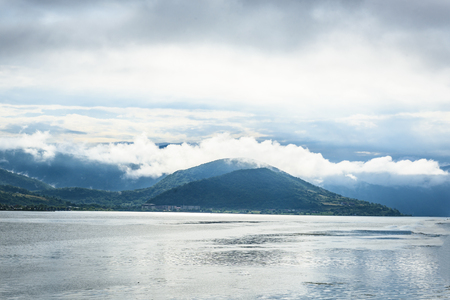 Landscape of hills covered with cloudsの写真素材