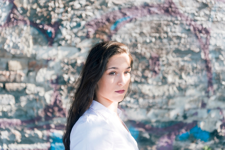 Beautiful female portrait with wall background,selective focusの写真素材