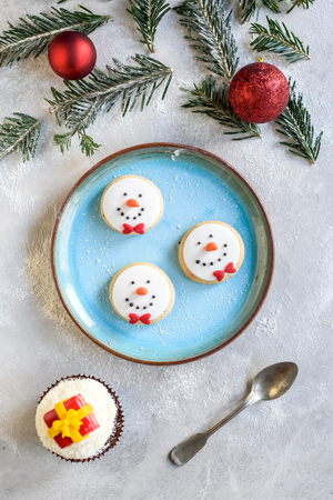 Served snowman cookies in the plate,selective focusの写真素材