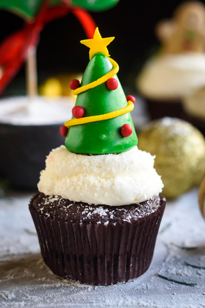 Christmas tree on the top of cupcake,selective focusの写真素材