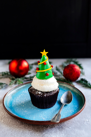 Sweet cup cake with Christmas tree,selective focusの写真素材