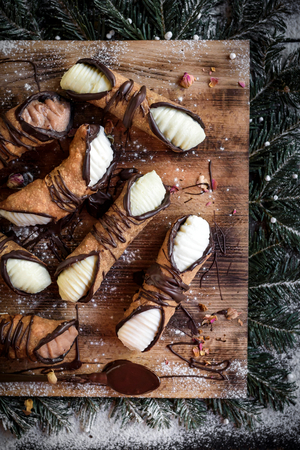 Christmas concept with traditional Sicilian cannoli,selective focusの写真素材