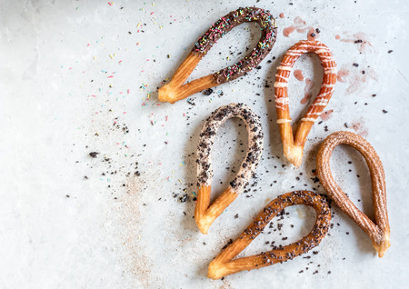 Traditional Spanish snack churros with toppingsの写真素材