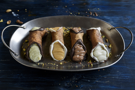 Traditional Sicilian dessert called cannoli with creamの写真素材