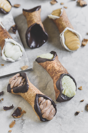 Traditional Sicilian dessert called cannoli with creamの写真素材