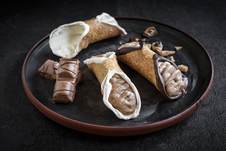 Traditional Sicilian dessert called cannoli with creamの写真素材