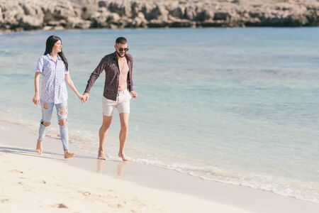 Happy couple on the beach have a god time,selective focus の写真素材