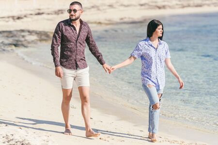 Happy couple on the beach have a god time,selective focus の写真素材