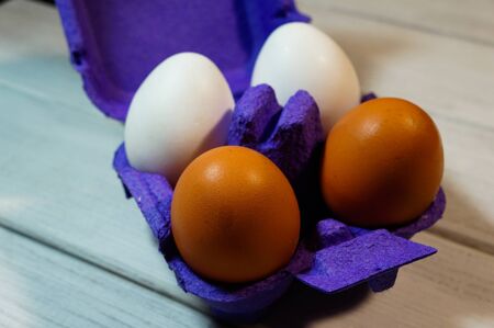 multi-colored eggs in purple packaging