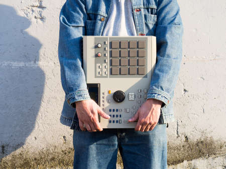 stylish and trendy Hip-hop composer, DJ in the neighborhood with his vintage drum machine. Rap musicの写真素材
