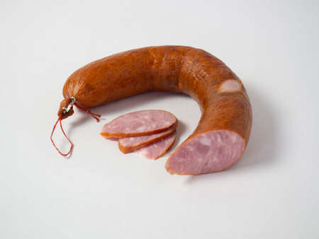 dried sliced sausage on a white isolated background