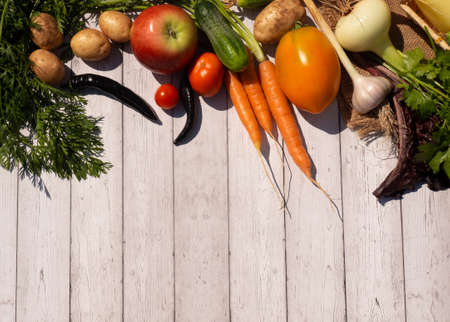 Vegetables on a wooden table. Bio Healthy food, herbs and vegetables from farm plantations.
