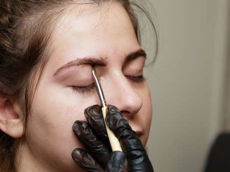 girl eyebrows are painted with hennaの写真素材