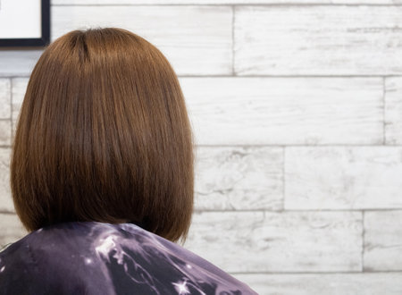 girl gets a new hairstyle in a beauty salon. professional hair styling.の写真素材