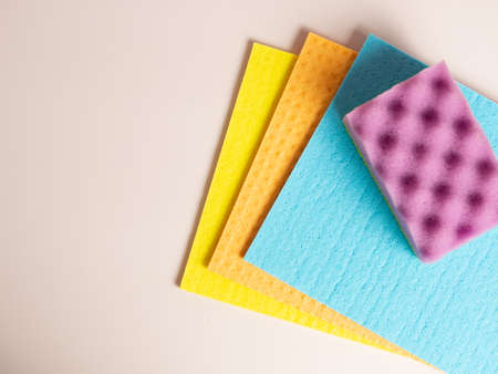 Cleaning sponges and rags on purple backgroundの写真素材