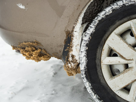 dirty snow on the fenders of the carの写真素材