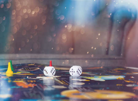 board game concept. Dice, chips and cards on the background of the playing field copy spaceの写真素材