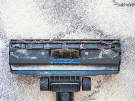 Dirty vacuum cleaner brush with dust. cleaning conceptの写真素材