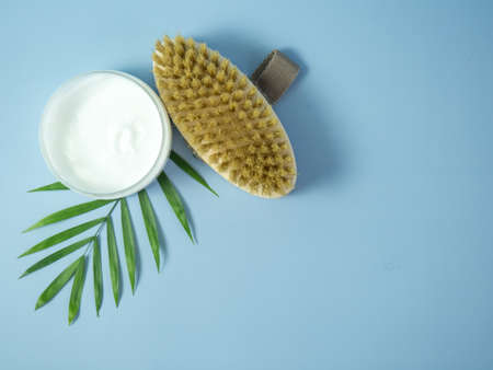 on a blue background brushes for face and body massageの写真素材