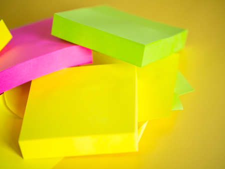 background from a stack of colorful paper stickers