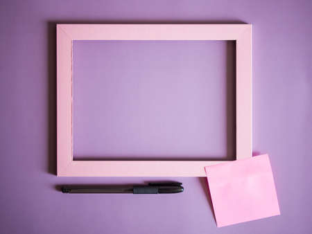 Minimal composition with empty pink frame and space for textの写真素材