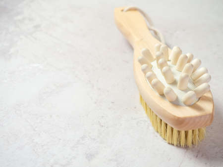 on a concrete background accessories for spa treatments, brushes for face and body massage,の写真素材