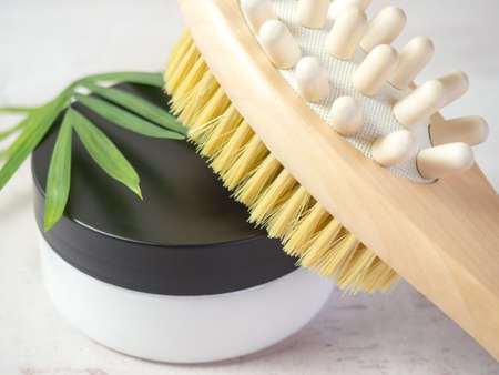 on a concrete background accessories for spa treatments, brushes for face and body massage,の写真素材