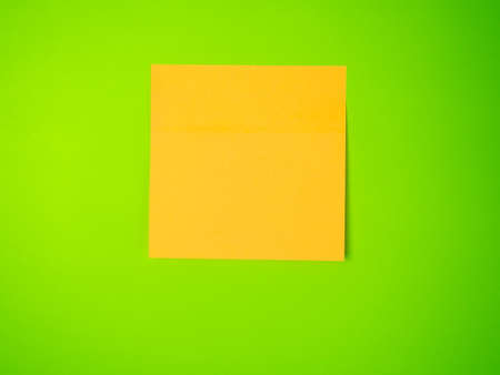 blank sticker for notes on green background