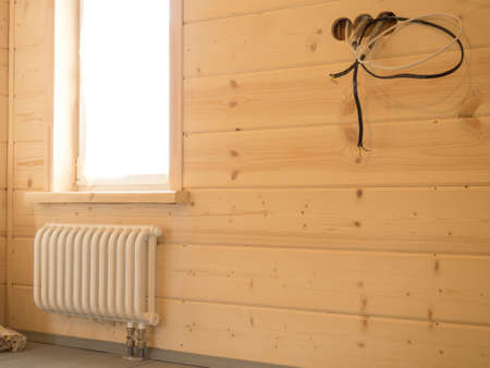new radiator and thermostat in a country house - close-up heaterの写真素材