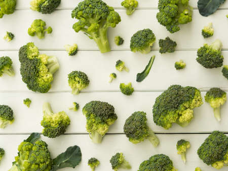 broccoli pieces on white table patternの写真素材