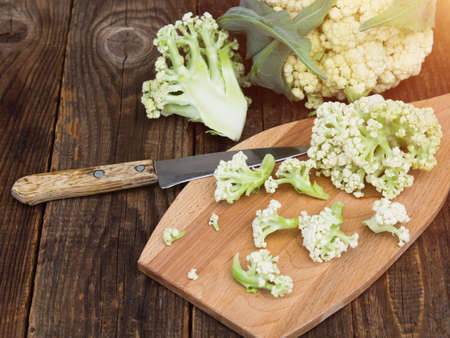 Organic cauliflower on a wooden table close upの写真素材