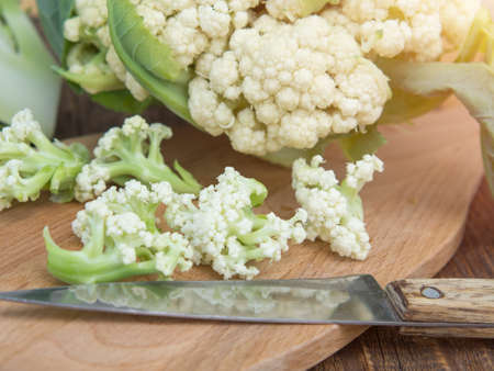 Organic cauliflower on a wooden table close upの写真素材