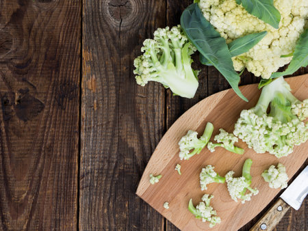 Organic cauliflower on a wooden table close upの写真素材