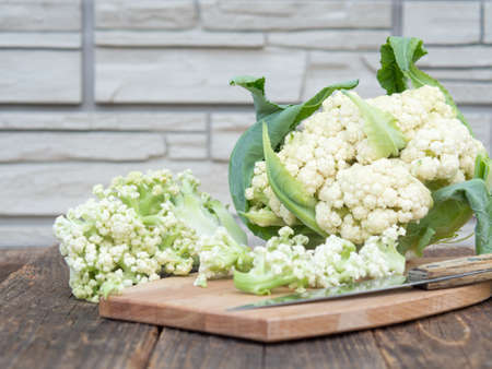 Organic cauliflower on a wooden table close upの写真素材