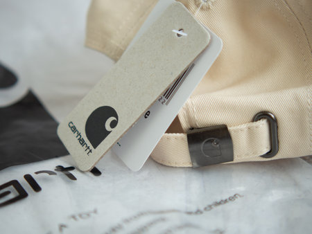 moscow. russia. 08.06.2022.Carhartt logo. Carhartt WIP brand, Carhartt logo and font close-up, cap and T-shirt with Carhartt emblemのeditorial素材