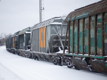 railway freight cars on the rails in winterの写真素材